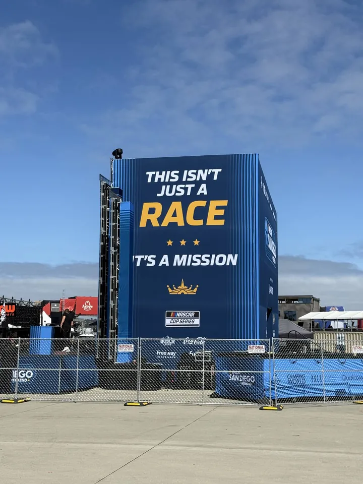 A tall blue sign reading This isn't just a race, it's a mission