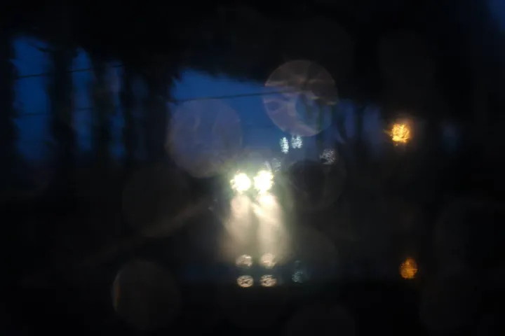 Headlights blurred into soft color at night